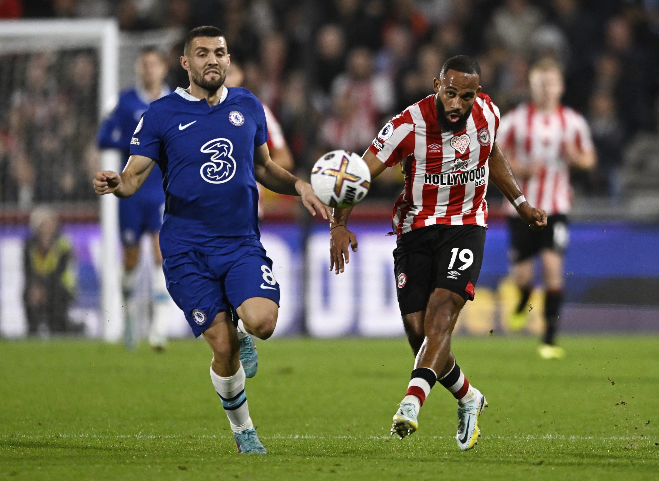 Brentford's Bryan Mbeumo in action with Chelsea's Mateo Kovacic