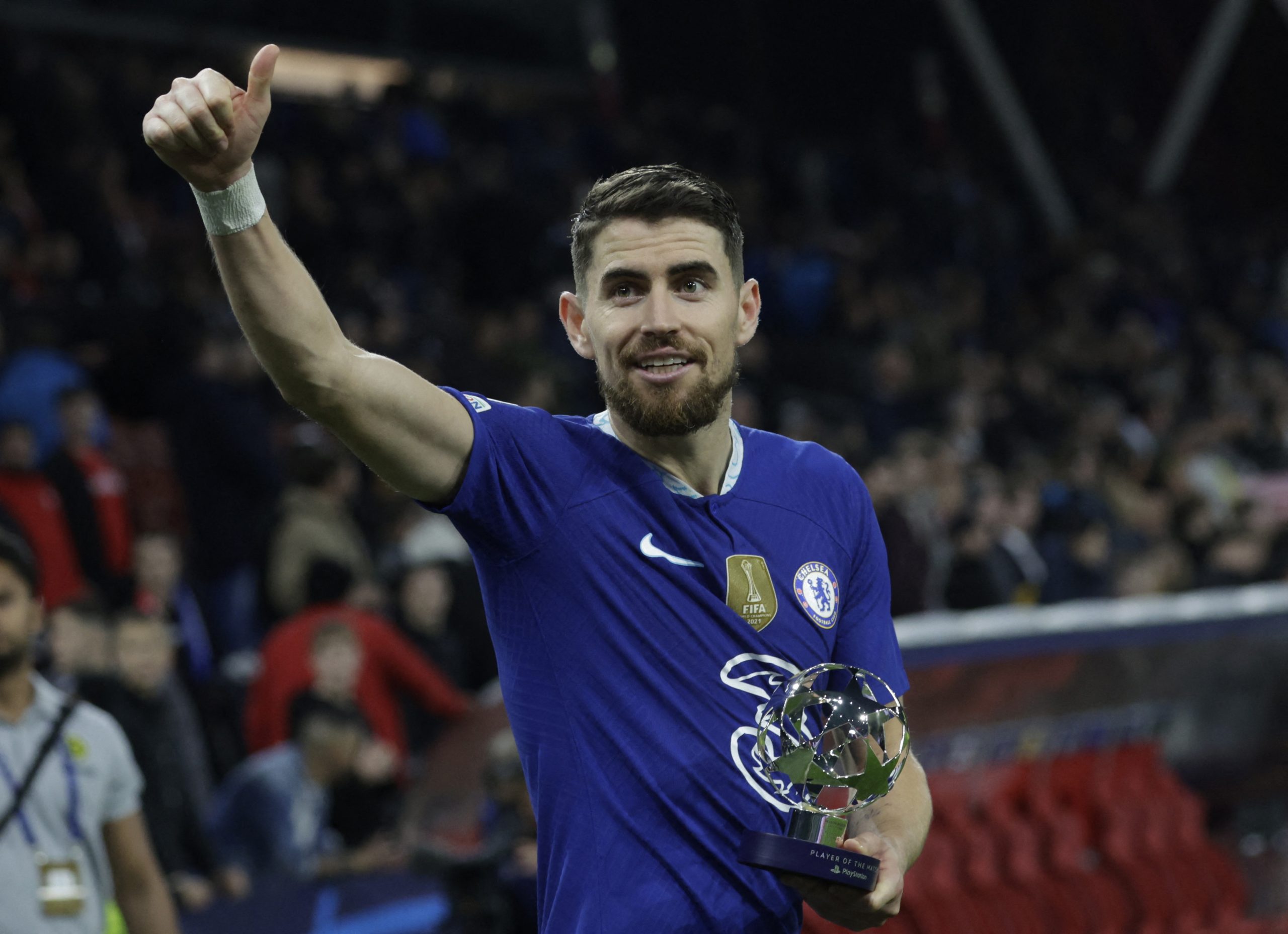 Chelsea's Jorginho celebrates with the player of the match trophy after the match